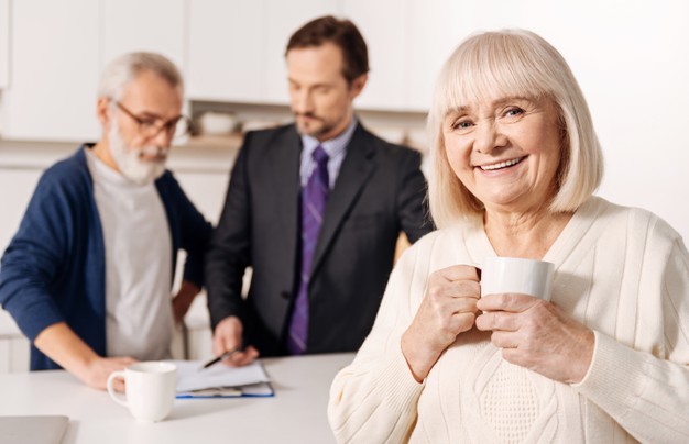 A Woman With Blond Hair Holding a Cup