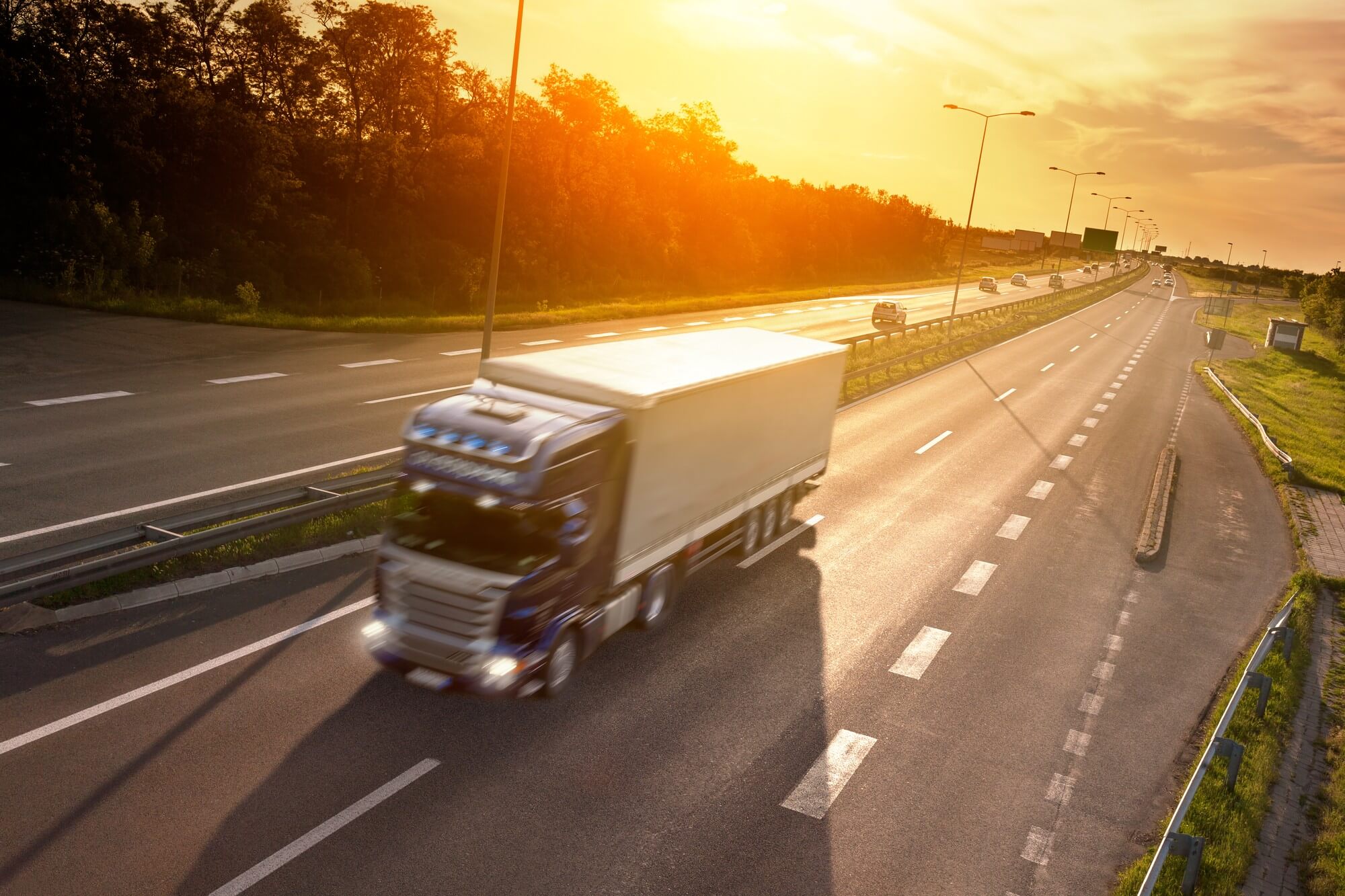 A Moving Truck Racing on a Highway