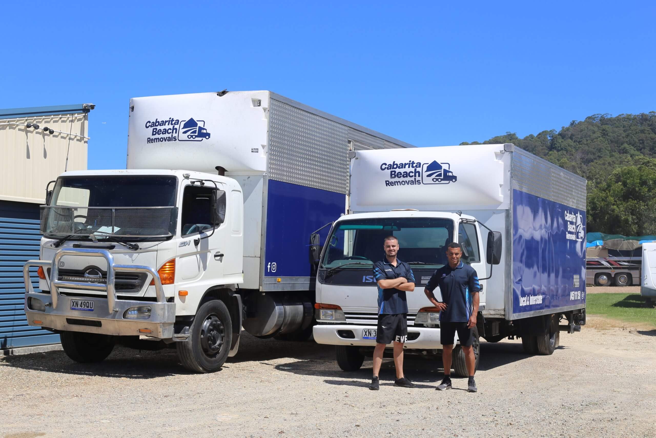 Two White Color Trucks Side by Side